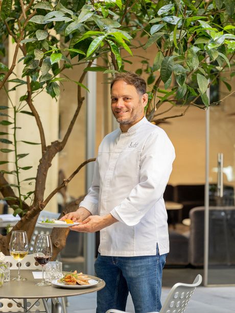 Chef Xavier Lahuerta by the Orange Trees Patio of the Mercer Hotel Barcelona